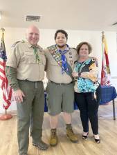 Eagle Scout Kevin Kapuscinski, of Andover, with his parents.