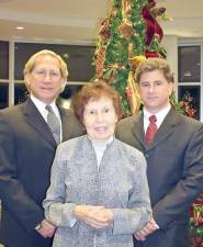 Louis Ruggiero, President of Iliff-Ruggiero Funeral Home; Julia Quinlan, co-founder and president of Karen Ann Quinlan Hospice; and Domenick Ruggiero, manager of Iliff-Ruggiero Funeral Home gather at a former Lights of Life Tree Lighting Memorial Service at Sussex County Community College (Photo provided)