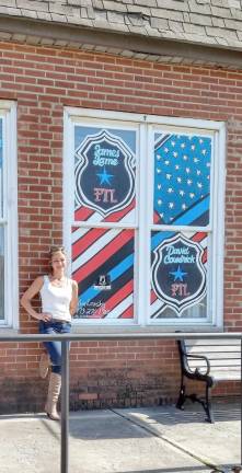 Original paintings honor police officers Kim Lonsky with a window painting at Bathing Beauties in Ogdensburg (Photo provided)