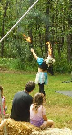 Knights and faeries roman the woods of Sparta A fire-eating faery performs