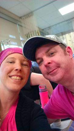Byram man to cycle across US to raise funds for cancer victim Robin with husband John, at her chemotherapy treatment.