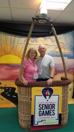 Senior Olympics Carol and Rich Schubert pose for a photo at the balloon basket, after checking in at the Senior Olympics in New Mexico.