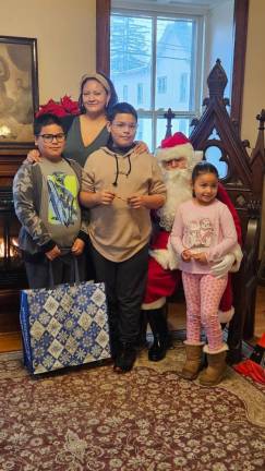 The Juca family poses with Santa.