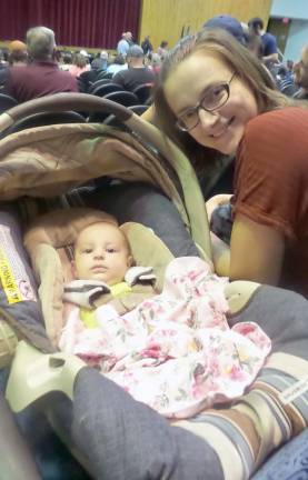 Baby Vera, 2.5 months old, attends her first school board meeting with her mother, Ludmila Keller (Photo by Frances Ruth Harris)