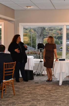 Stillwater’s Chammings named Mayor of the Year Michelle Osario, senior small business liason, talks as Sussex County Chamber of Commerce President Tammie Horsfield listens.