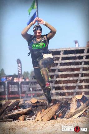 Smith performs the Beast Fire Jump part of the Spartan Obstacle Course Race.