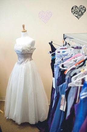 Girls are invited to select a prom dress Prom dresses are available at the Sister-to-Sister Prom Shop in Newton (Photo by Rob Yaskovic)