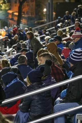Fans bundled up enjoying the Friday night game.