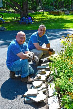 Photos: Volunteer Day at Rebecca’s Homestead <b>Rich Clemente of Boonton and Melvin Pena of New Windsor, N.Y., fix the curb.</b>