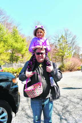 Greg Beckley holds his daughter Holly on his shoulders.