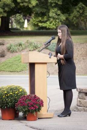 Casey O'Connell Choate reads a poem to the audience during the LODD Ceremony for her father, Byram Twp Firefighter Richard Choate.