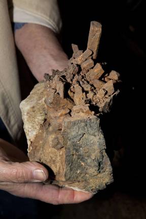 Treasure hunt Glenn Rhein Holding one of his mineral rocks at his home in Amity