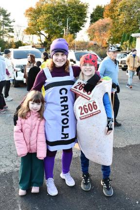 Newton High School hosts Monster 5K Myka Zwarych of Blairstown, and Claire and Bastian Oelschlager of Scotch Plains are shown.
