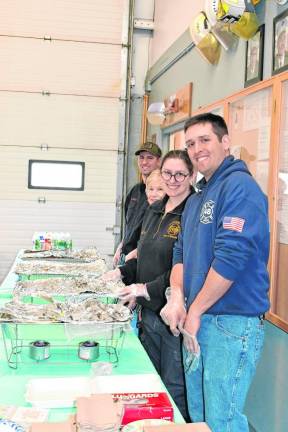 Brendon Dela Torre, Samantha Waldron, Sandy Ostrander and Greg Pellingdon help serve the breakfast.