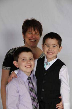 Mommy & Me Contest Liane Herman with sons Cole (8) and Logan (4). "Why we love you Mommy: Your nice, your funny, you always help us and you love us to the moon, stars, planets and back! You have nice taste. Your never a sore sport when we play games. Your smart and beautiful and we hope you and Grandma have a very nice Mother's day! Your the best Mom ever! We love you!"