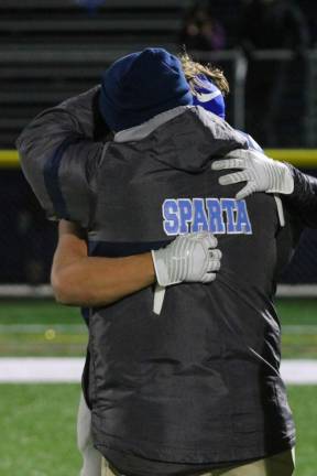 Austin Castorina and head coach Frank Marchiano embrace, wrapping up their 4 years together.