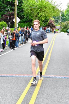 Photos: Girls on the Run 5K Lucas Lamb, 30, of Montclair finishes first with a time of 21:11.68.