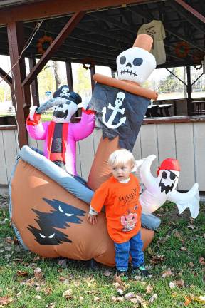 Photos: Haunted Hawk Hustle 5K Logan Rathbun of Newton poses with decorations at the Haunted Hawk Hustle 5K on Saturday, Oct. 11 at the Hampton Pit in Newton.