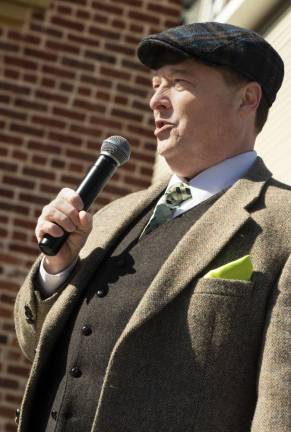 Mark Hontz, a Newton lawyer, serves as MC for the parade.