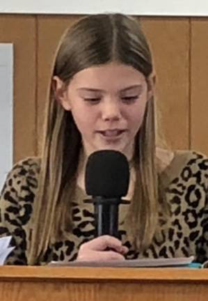 Veterans honored with parade, ceremony Brooklynn Davis of Frankford Township School reads her essay.