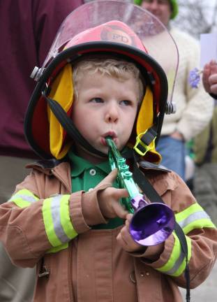 Irish pride Photos by Gale Miko Aspiring fireman Zachary Rosa from Newton played his horn at the St. Patrick's Day parade on March 17.