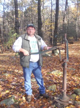 Byram Charity Hike held at Hudson Farms Allen Hay tries his hand at the water pump on the Byram Charity Hike at Hudson Farms