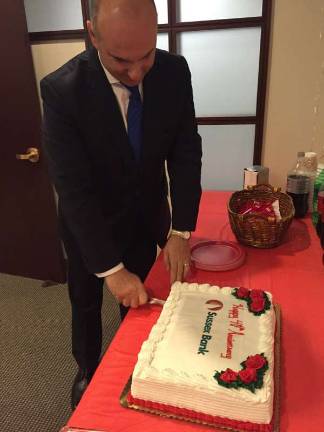 Sussex Bank celebrates 40th anniversary President and CEO of Susse Bank, anthony Labozzetta cuts the cake.