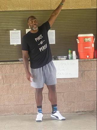 Motivational speaker Cornell Thomas speaks to campers at X-Treme Running Camp on Monday (Photo by Laurie Gordon)