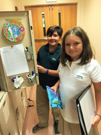 Hilltop school's enrollment increases Fifth graders Antonio Puopolo of Montague, left, and Robin Guarda of Lake Hopatcong stop at their lockers to switch books on the first day of school at Hilltop on September 7.
