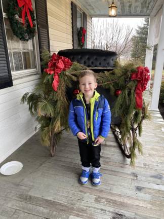 Pre-schooler Teddy Adams enjoyed the celebration: especially the minstrel.