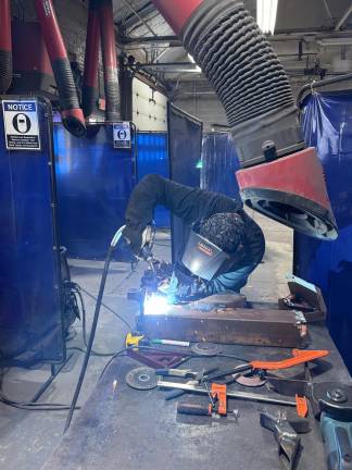 From classroom to career <b>A member of SCCC’s welding program is hard at work. (Photos by Bryan Fumagalli)</b>