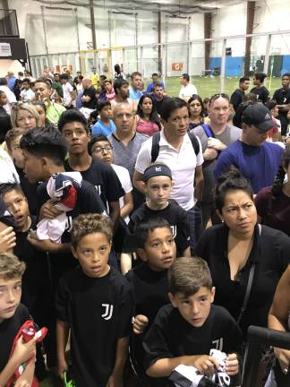 Italian soccer club opens first-ever training center in Sparta Kids and parents line up to get autographs from Juventus players.