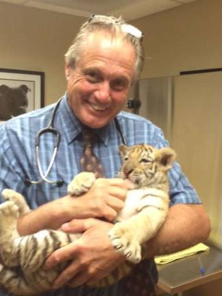 Sussex County dogs getting sick despite vaccines Straus file photo Ted Spinks, DVM, with a non-canine patient.