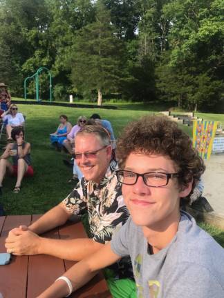 Jack and Jackson Choma enjoy the music at the lake. (Photo by Laurie Gordon)