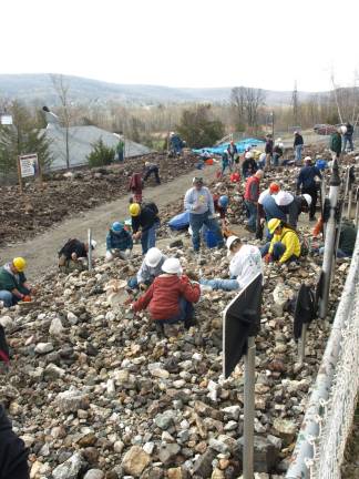 Chipping away for treasure Photos by John Church Rock hounds searching through the Mine Run Dump for specimens.