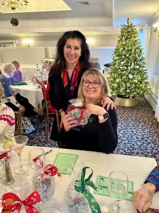The Newton Country Club Ladies Golf Association collects money and canned goods at its holiday luncheon to benefit the work of the Samaritan Inn.