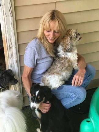 Sussex County dogs getting sick despite vaccines photo by Amy Shewchuk Pet Spa & Resort owner Lynn Wilkins with some of her guests.