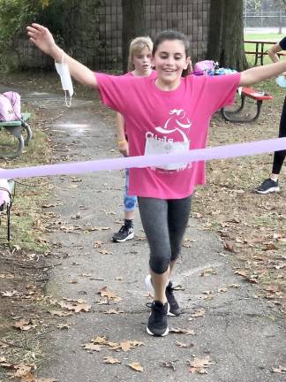 Emma Cavanaugh crosses the finish line (Photo provided)