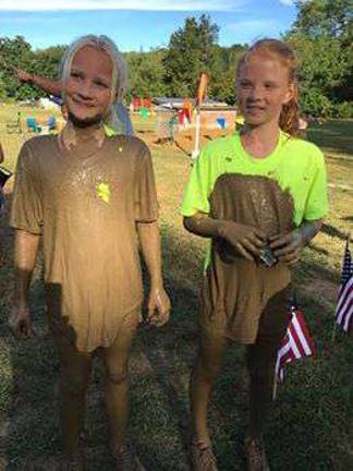 Getting dirty for a great cause PHOTOS BY LAURIE GORDON Twins Tate (left) and Carly (right) Swenson, of Sparta, greatly enjoyed Sunday's Mud Run