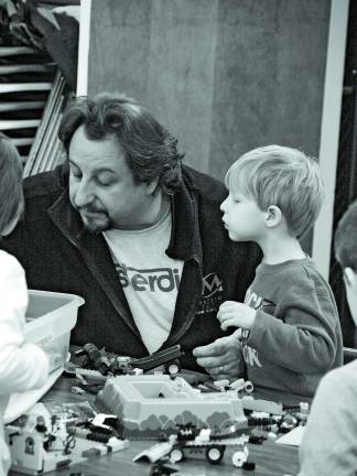 Lego builders start young Photo by John Church Four-year-old Adam Special with his dad Paul look for bits and pieces to complete their project.