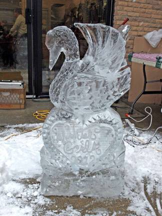 Cutting the ice A splash of water adds polish and shine to the sculpture.