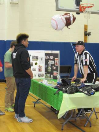 From baseball to microbiology Eighth-grader Issiaha Robinson 'pleads his case' to varsity football official George Yonki at Stanhope's Career Day.