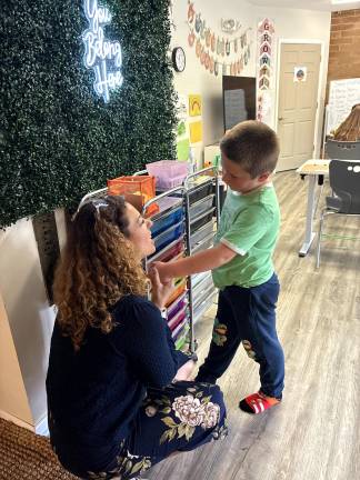 School options ‘born from necessity’ Roots & Wings Founder Jenny Mills talks to student Roman Yangis-Faulkner, of Greenwood Lake, NY, the second day of school.