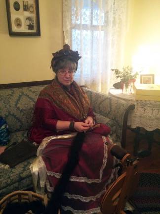 Keepers of Coursen Corners keep history alive and museum thriving Photos by Laurie Gordon A spinner works with yarn to demonstrate how it was done in the olden days.