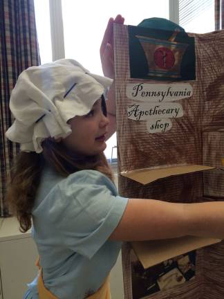 Students bring history alive with Colonial Fair Julia St. Clair explains how important spices were in Colonial times.