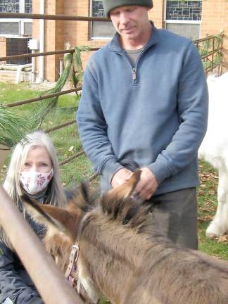 ‘Ye shall find the babe wrapped in swaddling clothes, lying in a manger’ Elizabeth Neillands of Pond Hollow Farm poses with two of her friends, including her donkey, Belle, at the live nativity. Neillands also brought two goats, a Welsh pony, and her Scottie dog, Hattie (Photo by Janet Redyke)