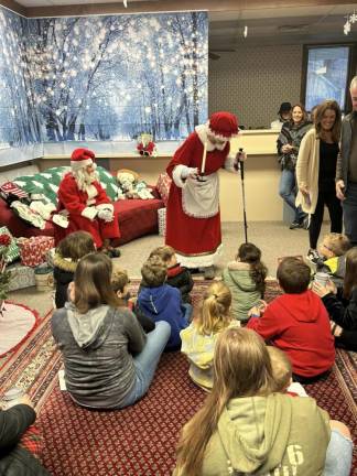 Storytime was held in the former bank during ‘A Yule Time Stroll’ winter festival Sunday, Dec. 17. (Photos by Laurie Gordon)