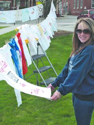 The shirts tell the tale Cassandra DeLucchi of Stillwater, a DASI sexual assault counselor, reads the messages on the T-shirts.