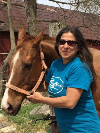 Horse rescue needs community's help to continue mission Diane Romano-Potocki poses with Sweet Rita, one of the horses she has saved living at Rivers Edge Rescue and Sanctuary. A direct descendant of the famous horse, Man-O-War, the Triple Crown Winner, Sweet Rita was sent to the slaughter house when she sustained a leg injury. Rivers Edge saved her and she'll live out her remaining days on the farm.