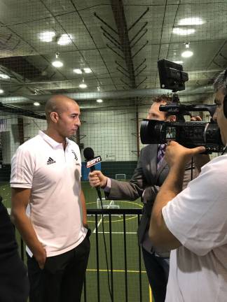 Italian soccer club opens first-ever training center in Sparta David Trezeguet, a retired Juventus professional soccer player and now Juventus coach, being interviewed at the grand opening.